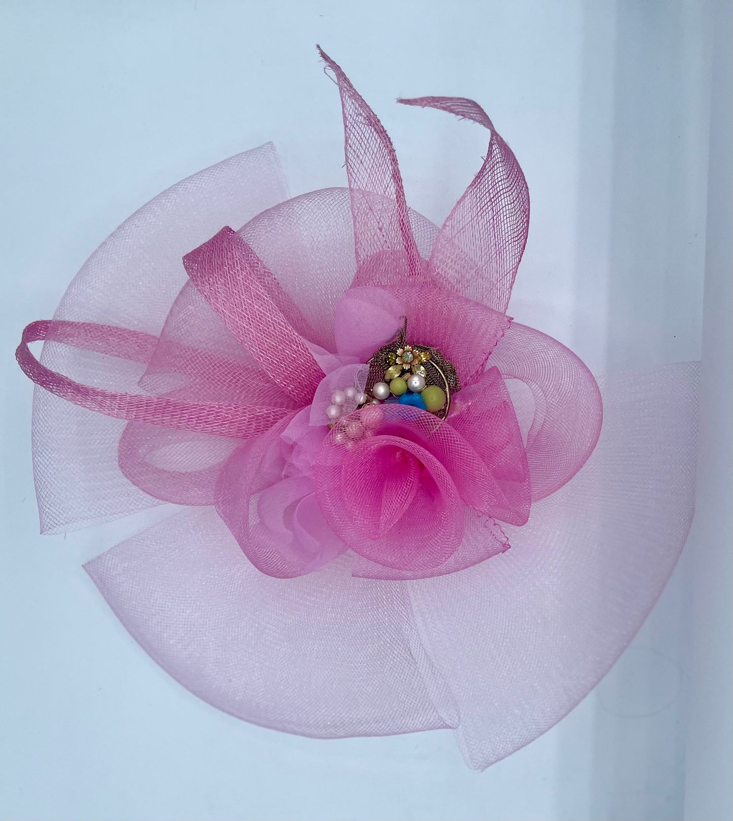 Pink fascinator , horsehair and sinemay. Bejeweled  center