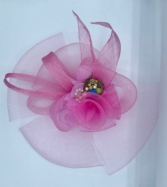 Pink fascinator , horsehair and sinemay. Bejeweled  center